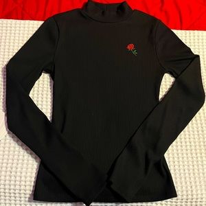 From Forever21 ,long sleeve shirt with a Little rose on the left side.